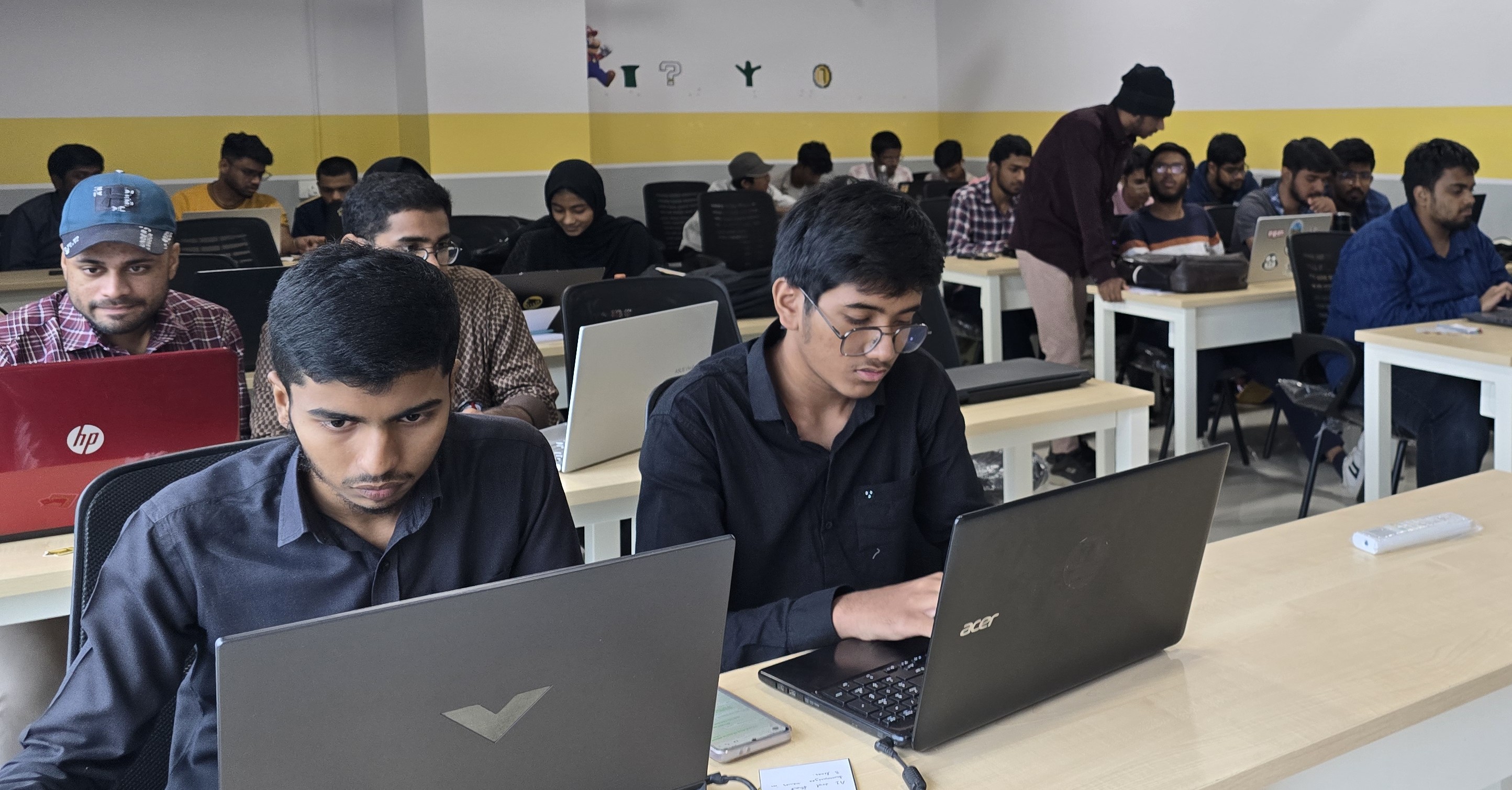 Students participating in a collaborative coding workshop